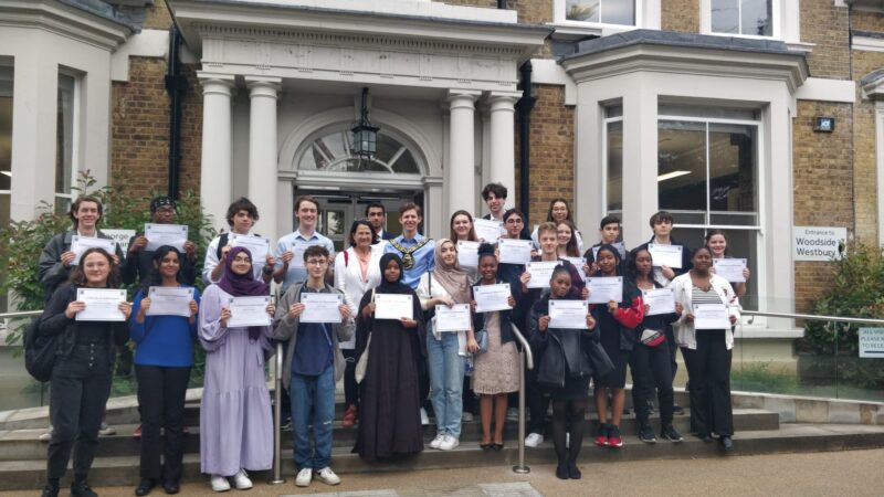 Receiving their achievement certificates with Haringey