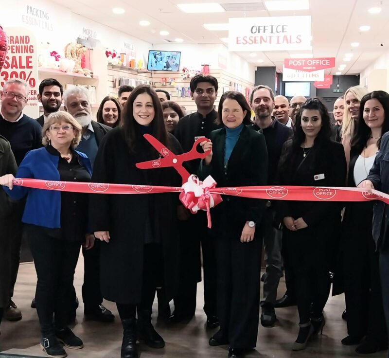 Catherine cuts the ribbon to officially open the  new Wood Green Post Office with Cllr Peray Ahmet and Cllr Ruth Gordon